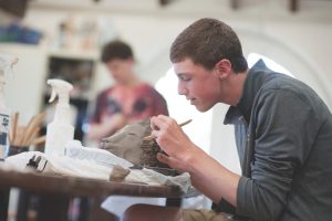 Watkinson Campus Photos 2016 - 175 - boy doing sculpture